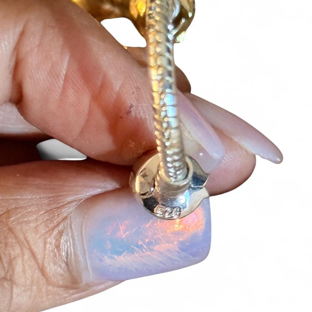 Sterling Silver bracelet w/charms gold tone